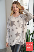 PLUS Long sleeve star print knit top with a round neck featuring a tie dye patch pocket, tie dye trim, and a side slit - Grey or Taupe