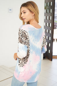 White Birch 3/4 sleeve tie dye knit top with a scoop neck featuring a dolman sleeve and leopard print trim detail - Light Blue.