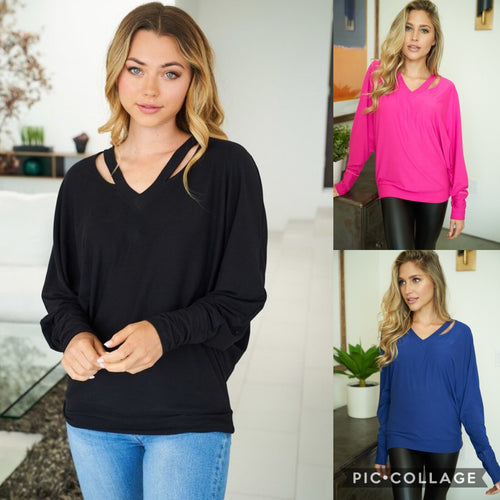 A long sleeve solid knit top with a v-neck featuring a cut out detail and a dolman sleeve - Black, Fuchsia or Royal Blue