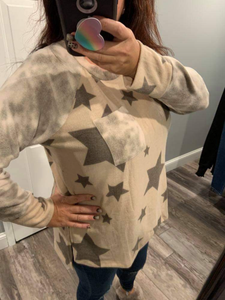 PLUS Long sleeve star print knit top with a round neck featuring a tie dye patch pocket, tie dye trim, and a side slit - Grey or Taupe