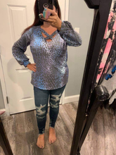 A PLUS SIZE long sleeve leopard print knit top with a v-neck featuring a criss cross detail and a puff sleeve - 💙 Blue/Purple 💜