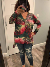 Plus Size long sleeve multi animal print knit top with a v-neck featuring a side slit and a high low hemline - Green/Pink