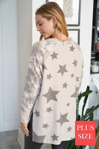 PLUS Long sleeve star print knit top with a round neck featuring a tie dye patch pocket, tie dye trim, and a side slit - Grey or Taupe