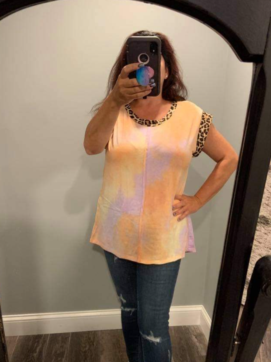 A short sleeve tie dye knit top with a round neck featuring a leopard print trim detail - Peach