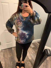 Tie dye knit top with a v-neck featuring a cut out trim detail and a puff sleeve -  Navy/Purple Mix