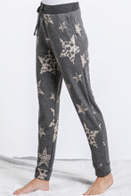 Star and animal print pants featured with drawstring and pockets