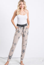 Star and animal print pants featured with drawstring and pockets