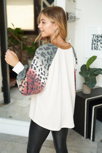 Long sleeve solid knit top with a round neck featuring a puff sleeve and a leopard print trim - Ivory or Olive