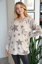 Long sleeve star print knit top with a round neck featuring a tie dye patch pocket, tie dye trim, and a side slit - Grey or Taupe